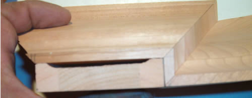 Picture of  crown molding:  wrapping cabinets with crown molding.