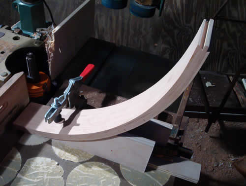 Picture of running radius cherry  door rails through a shaper.